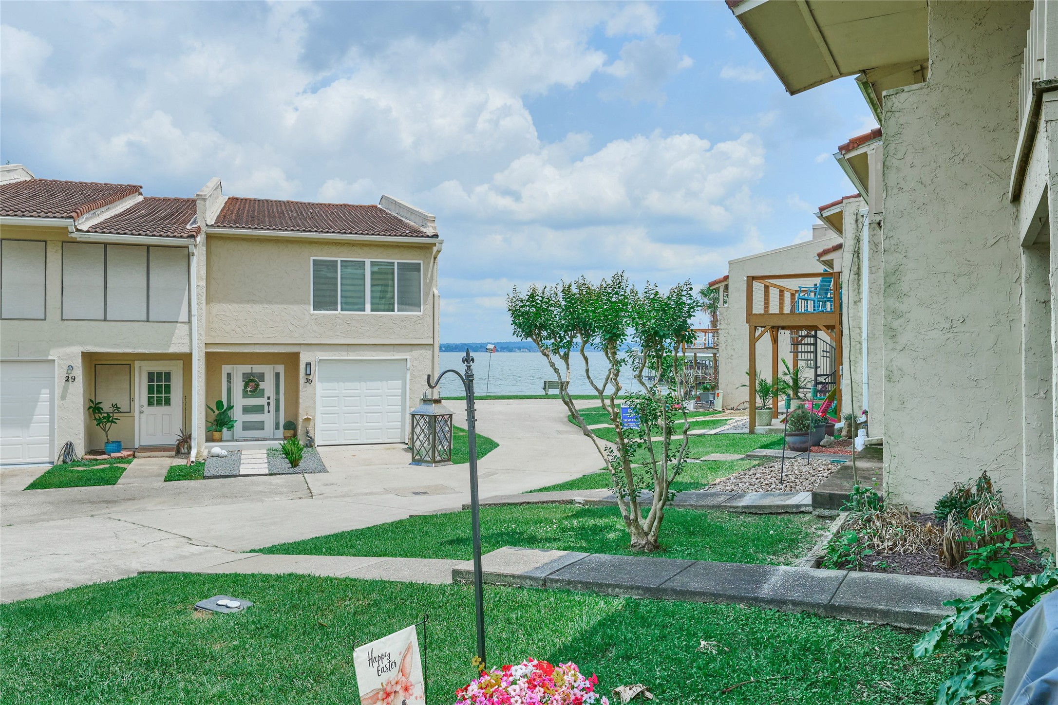 39 Regency Point Montgomery, TX 77356 - Photo 2 of 43 a front view of a house with garden