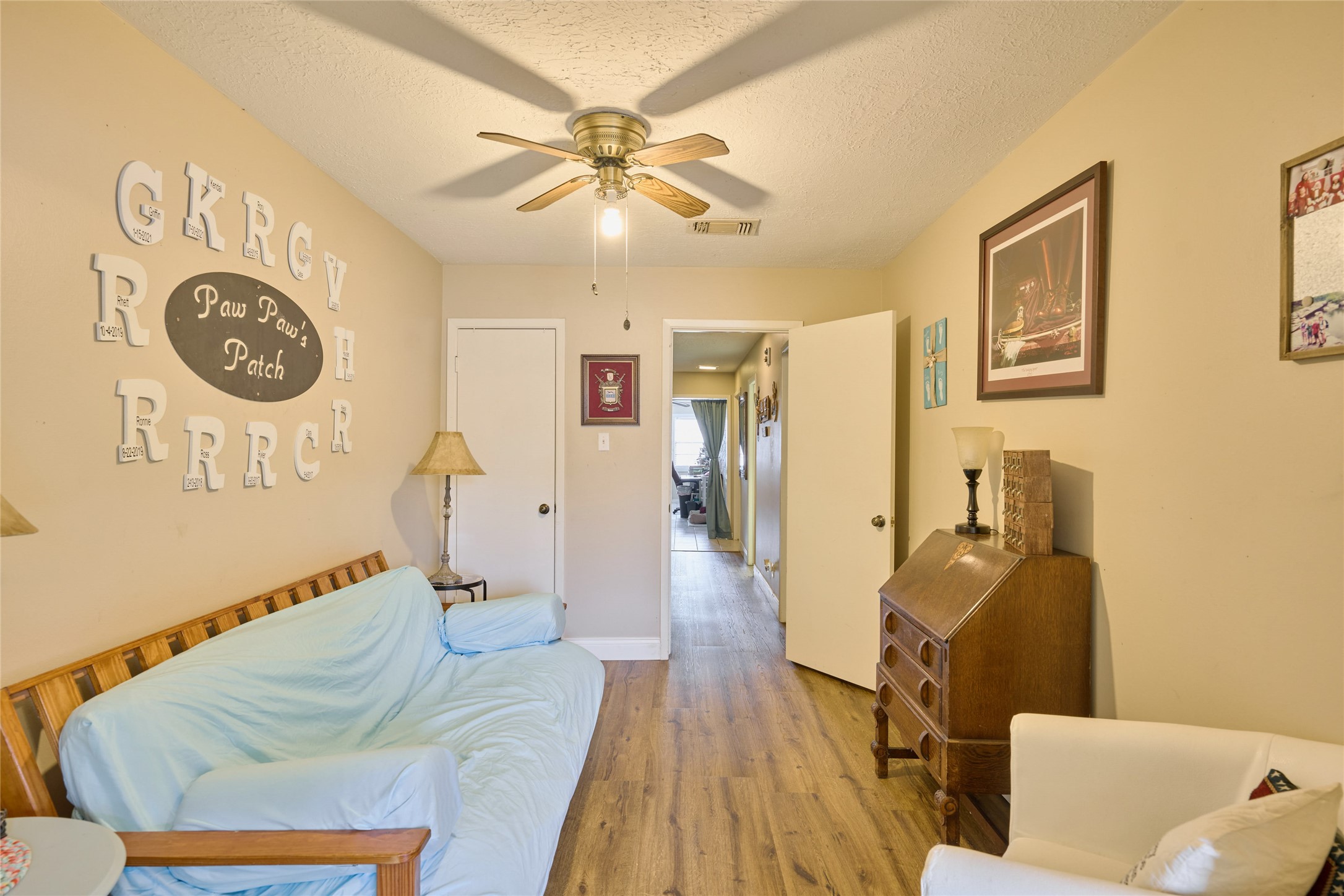 39 Regency Point Montgomery, TX 77356 - Photo 23 of 43 a bed room with a bed and a chandelier