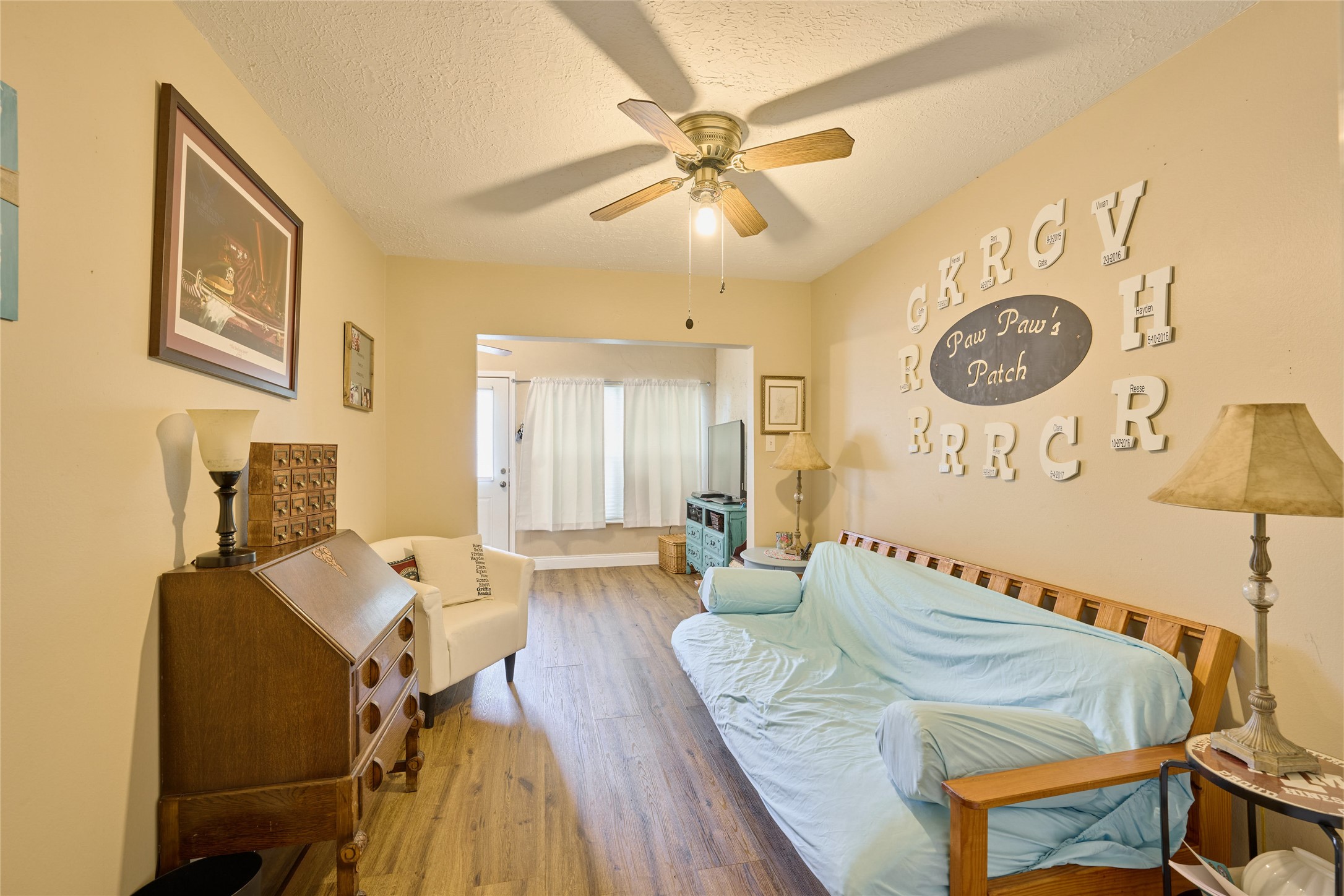 39 Regency Point Montgomery, TX 77356 - Photo 24 of 43 a bedroom with a bed and wooden floor