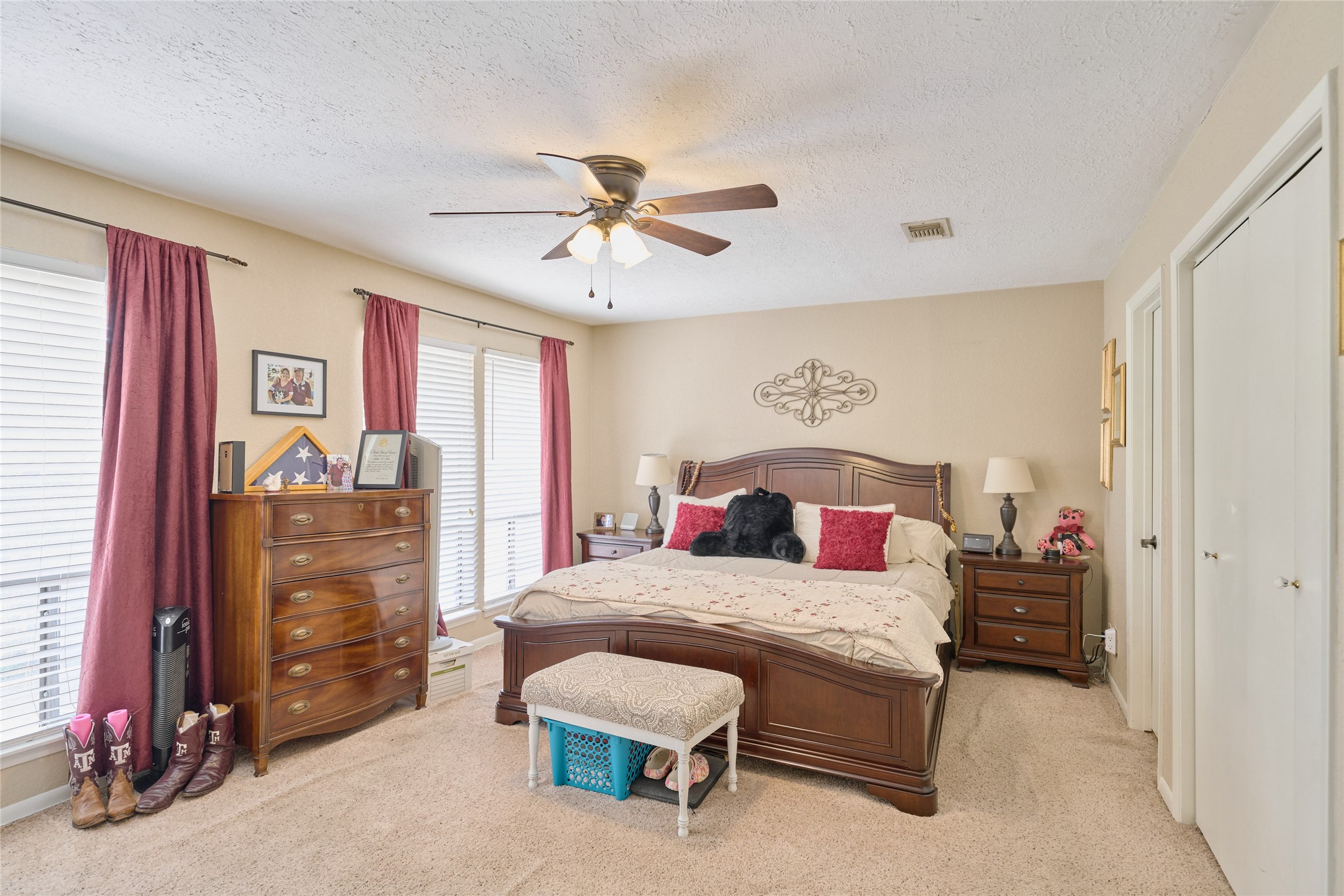 39 Regency Point Montgomery, TX 77356 - Photo 26 of 43 a bedroom with a bed and a chandelier