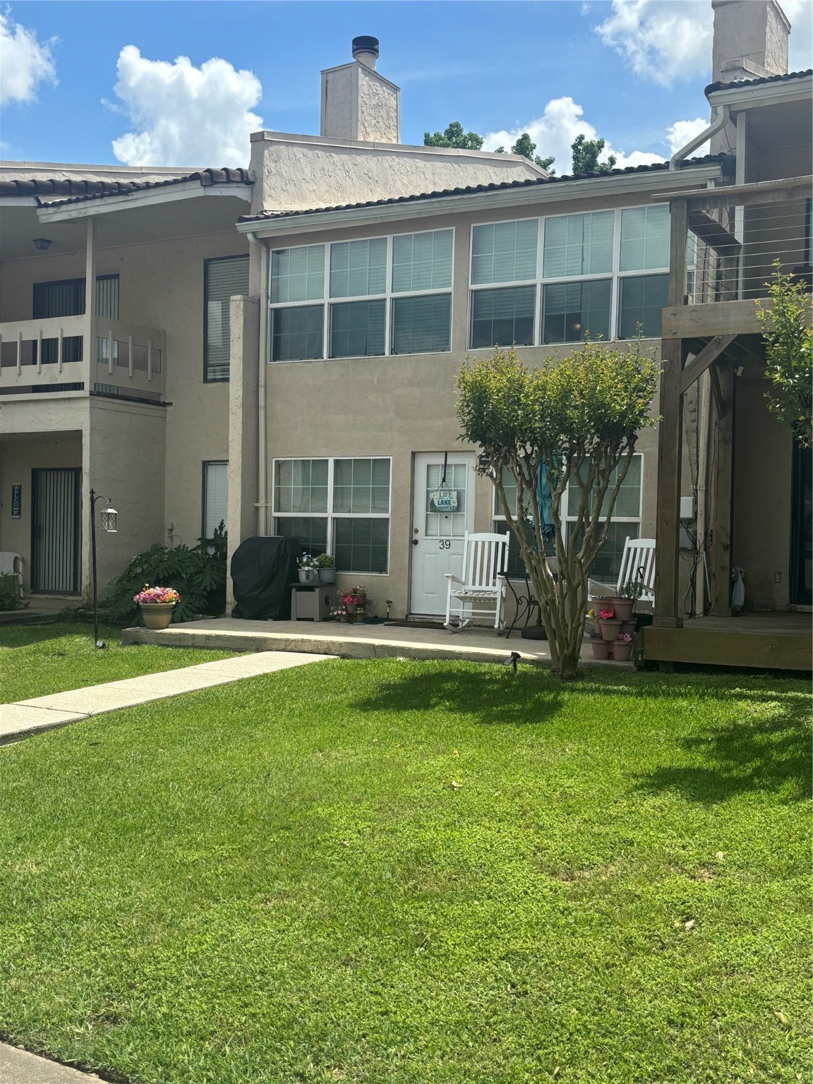 39 Regency Point Montgomery, TX 77356 - Photo 8 of 43 a front view of a house with a yard