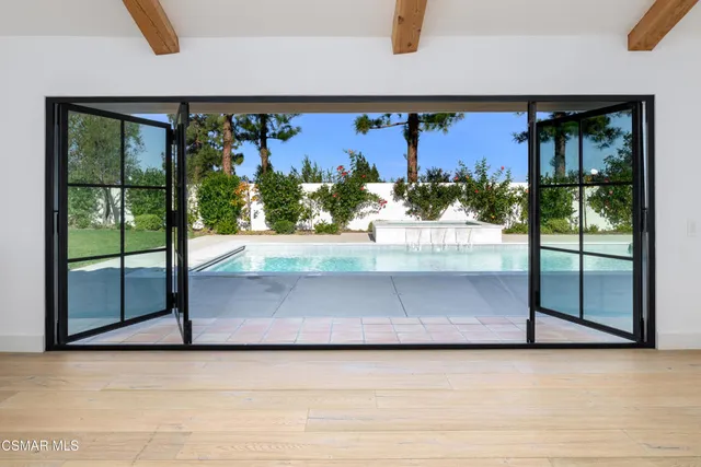 a bathroom with a double vanity sink mirror and shower