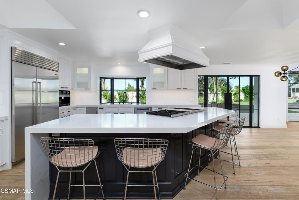 87 Pinecrest Road Westlake Village, CA 91361 - Photo 36 of 76 a view of a dining room with furniture and wooden floor