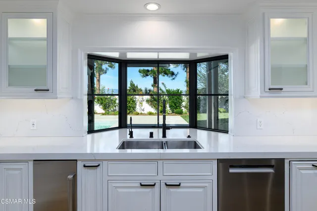 an aerial view of a house with a swimming pool