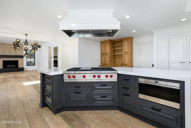 an aerial view of residential houses with outdoor space and swimming pool
