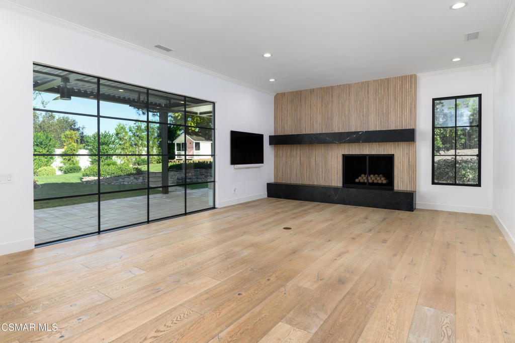 87 Pinecrest Road Westlake Village, CA 91361 - Photo 44 of 76 a view of empty room with floor to ceiling window and fireplace