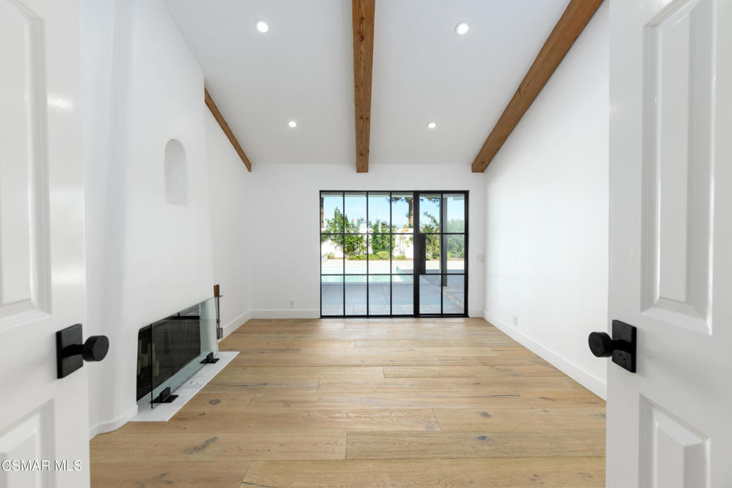 87 Pinecrest Road Westlake Village, CA 91361 - Photo 46 of 76 a view of an empty room with a fireplace and a window