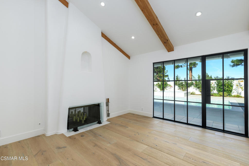 87 Pinecrest Road Westlake Village, CA 91361 - Photo 47 of 76 a view of an empty room with wooden floor and a window