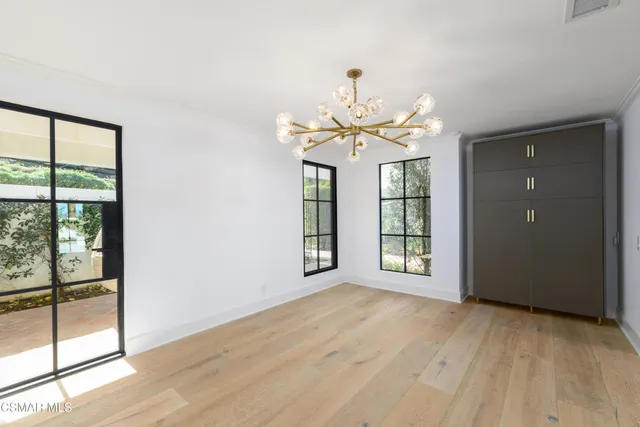 a view of a street with a building in the background