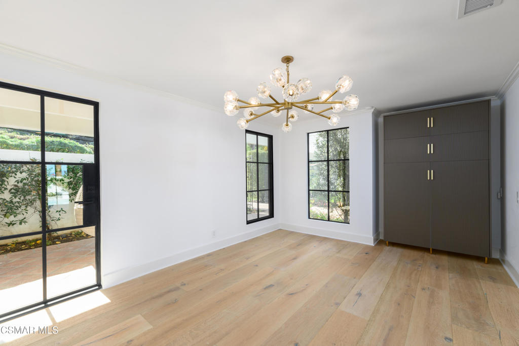 87 Pinecrest Road Westlake Village, CA 91361 - Photo 49 of 76 an empty room with wooden floor and windows