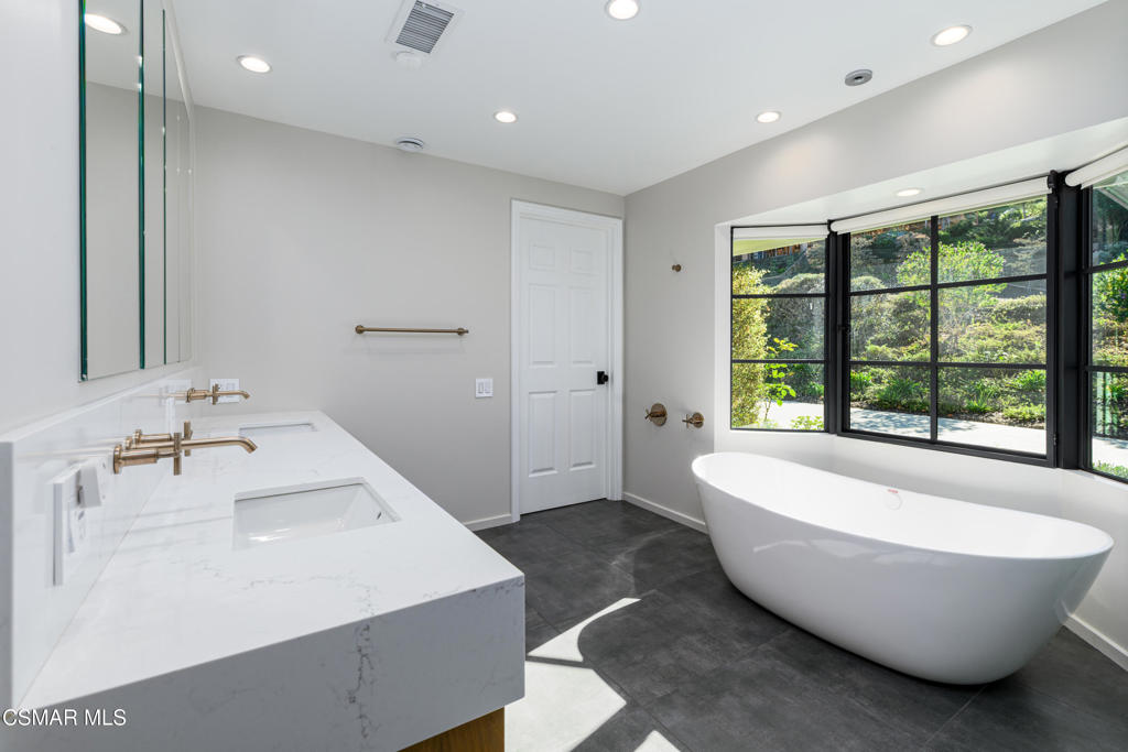 87 Pinecrest Road Westlake Village, CA 91361 - Photo 54 of 76 a spacious bathroom with a bathtub and sink