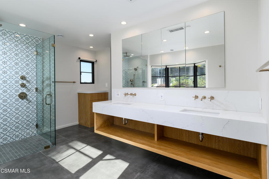 87 Pinecrest Road Westlake Village, CA 91361 - Photo 55 of 76 a bathroom with a double vanity sink mirror and shower
