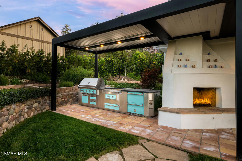 87 Pinecrest Road Westlake Village, CA 91361 - Photo 7 of 76 a patio with a table and chairs and potted plants