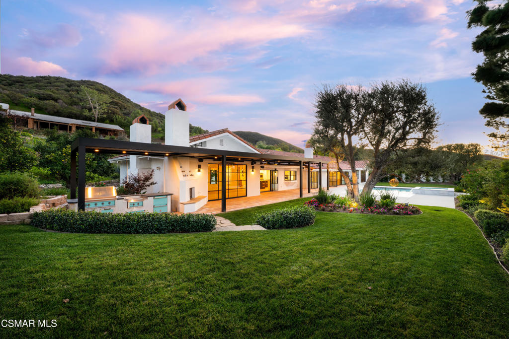 87 Pinecrest Road Westlake Village, CA 91361 - Photo 9 of 76 a view of a house with a big yard and large trees