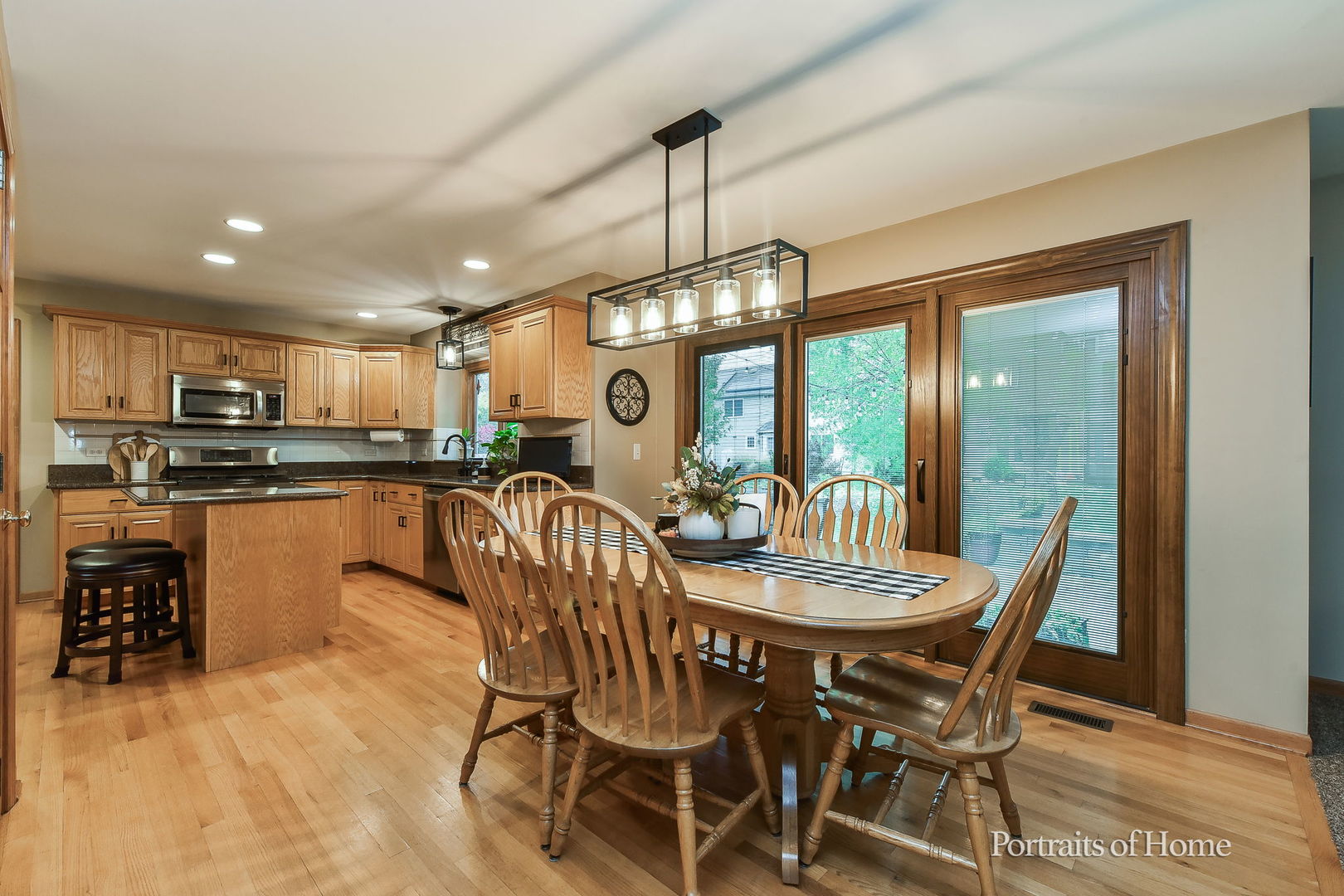 1813 Marne Road Bolingbrook, IL 60490 - Photo 11 of 30 a dining room with furniture a chandelier and wooden floor