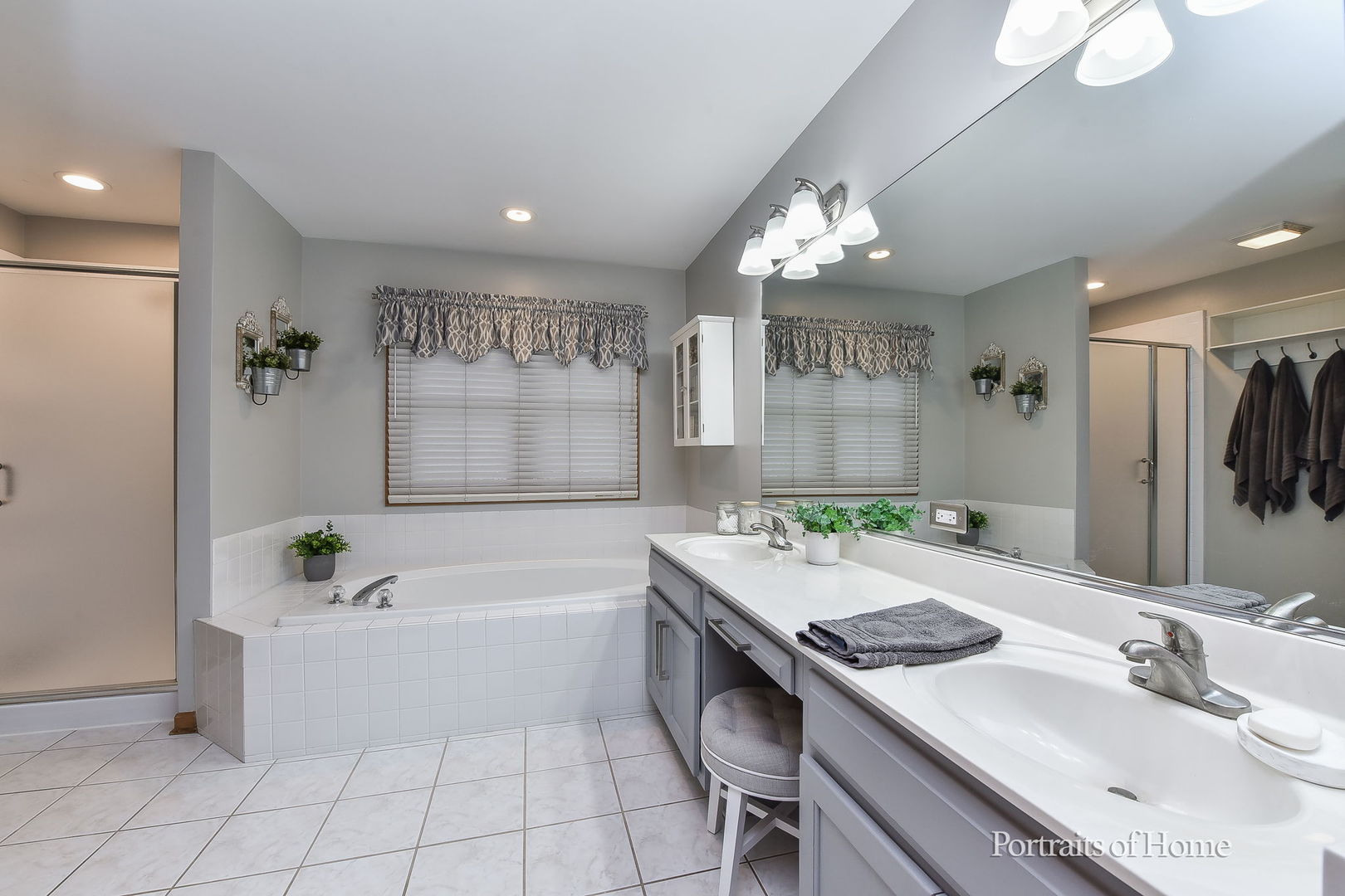 1813 Marne Road Bolingbrook, IL 60490 - Photo 17 of 30 a bathroom with a tub a sink and a mirror