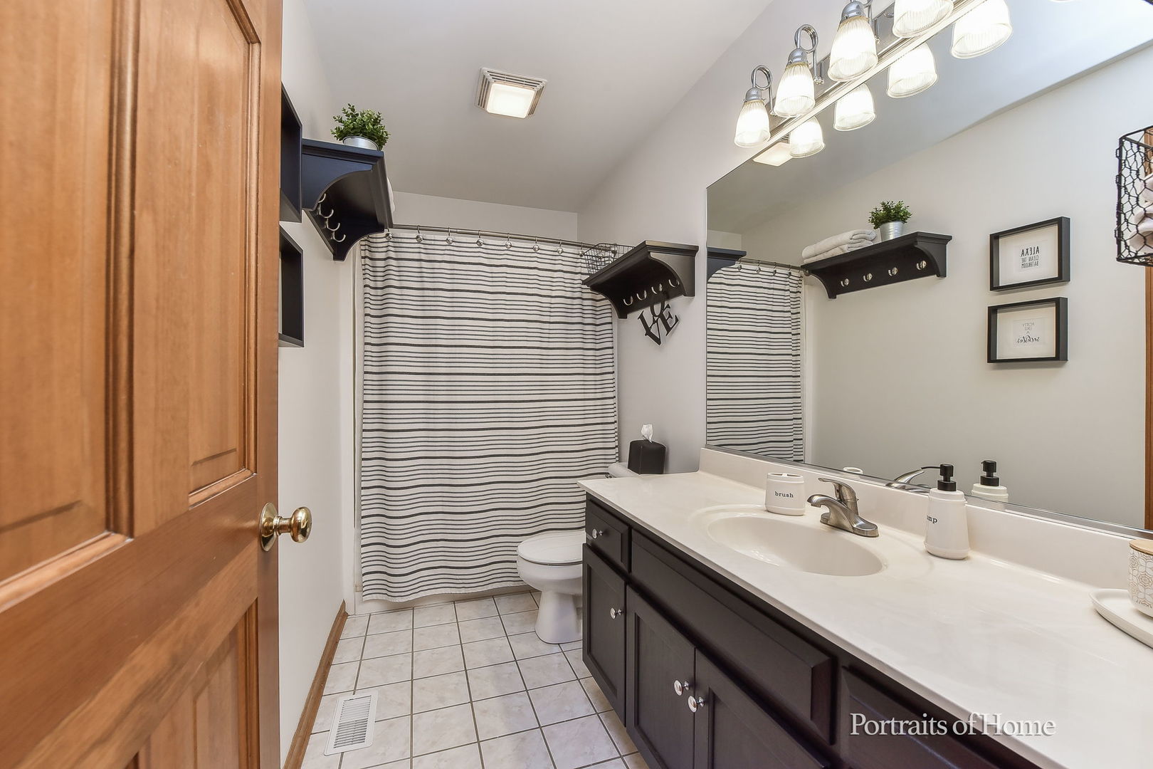 1813 Marne Road Bolingbrook, IL 60490 - Photo 22 of 30 a bathroom with a sink a toilet a mirror and shower