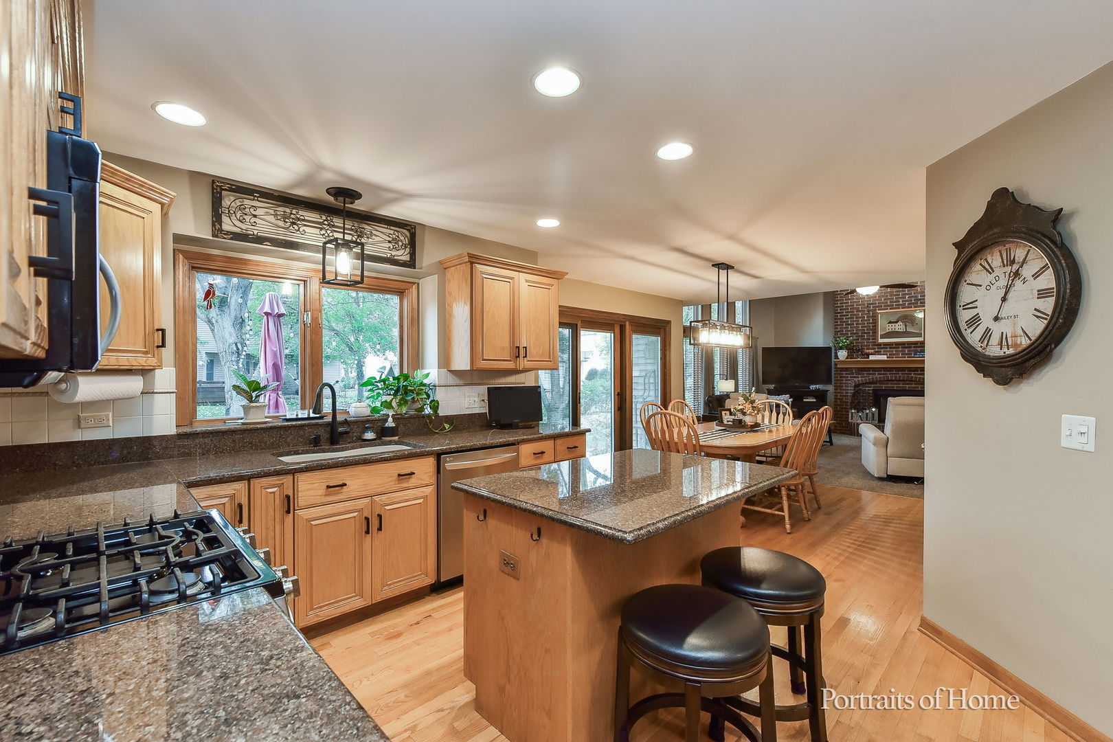 1813 Marne Road Bolingbrook, IL 60490 - Photo 8 of 30 a very nice looking open dining room with kitchen island granite countertop a table and chairs