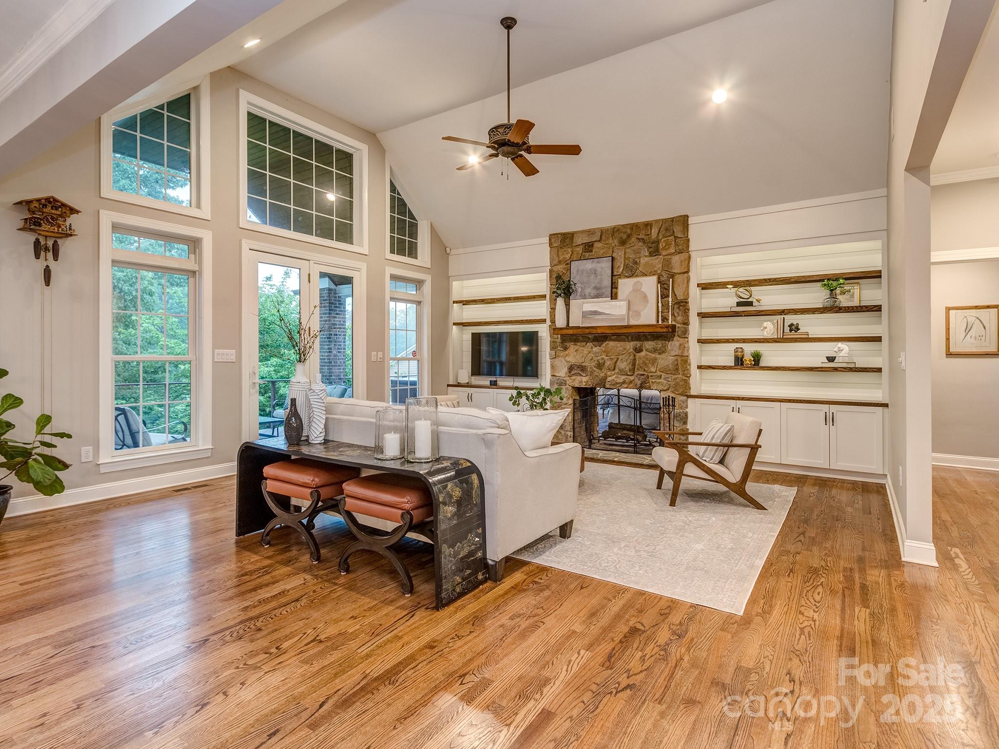 5951 Johnson Road Clover, SC 29710 - Photo 12 of 48 a living room with furniture a rug kitchen view and large windows