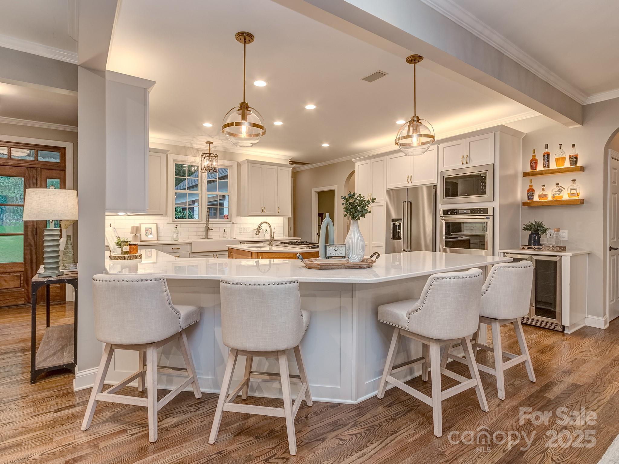 5951 Johnson Road Clover, SC 29710 - Photo 18 of 48 a kitchen with a dining table chairs and wooden floor