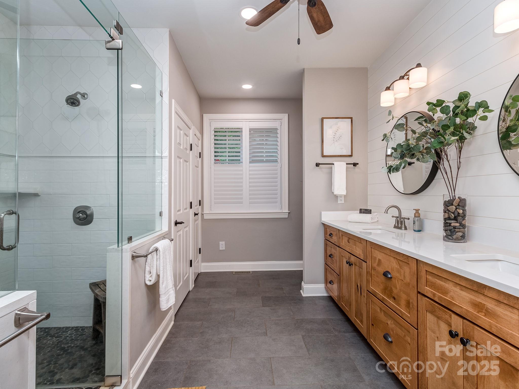 5951 Johnson Road Clover, SC 29710 - Photo 25 of 48 a bathroom with double vanity two mirror and a shower
