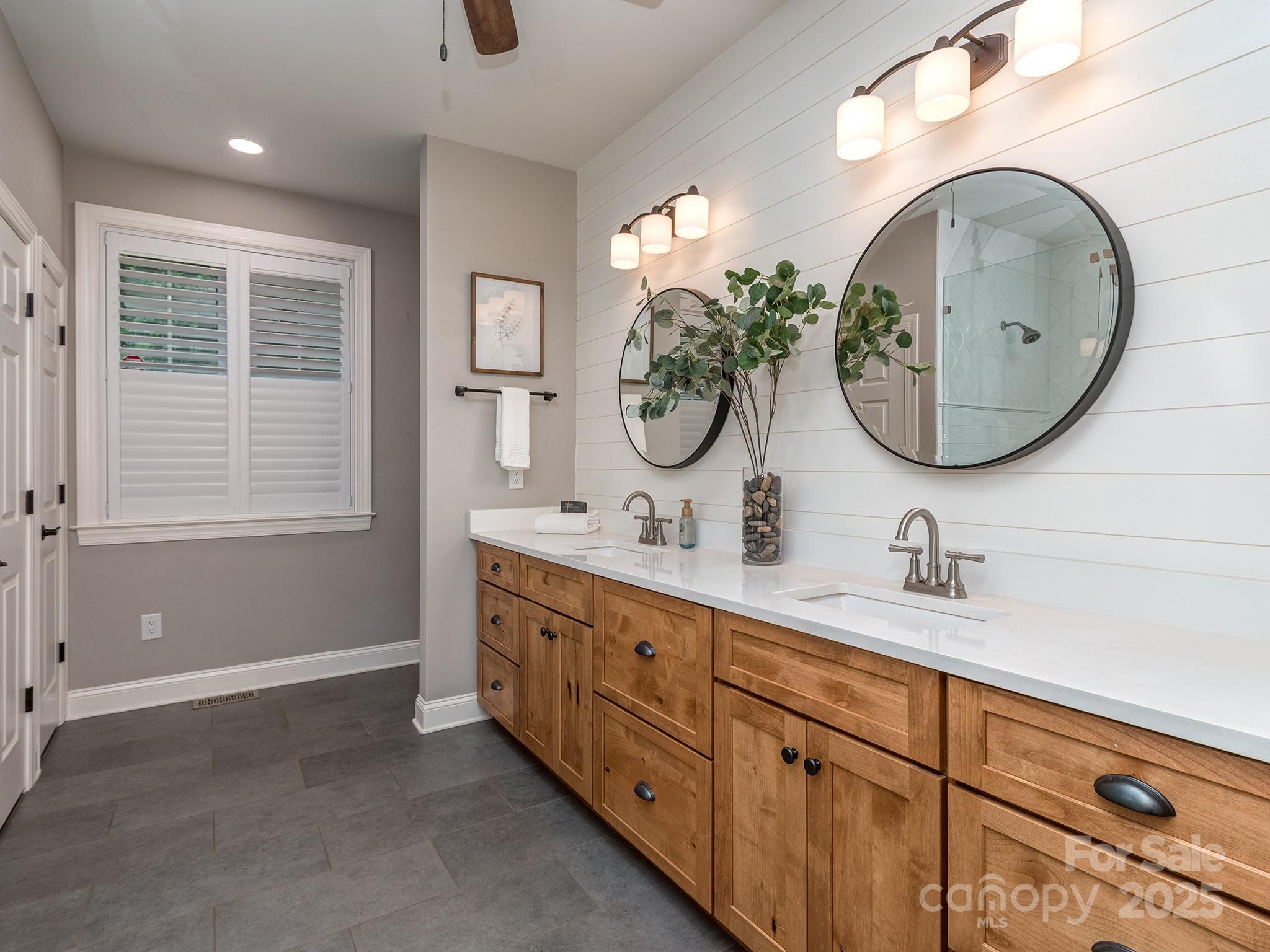 5951 Johnson Road Clover, SC 29710 - Photo 26 of 48 a bathroom with a double vanity sink and a mirror