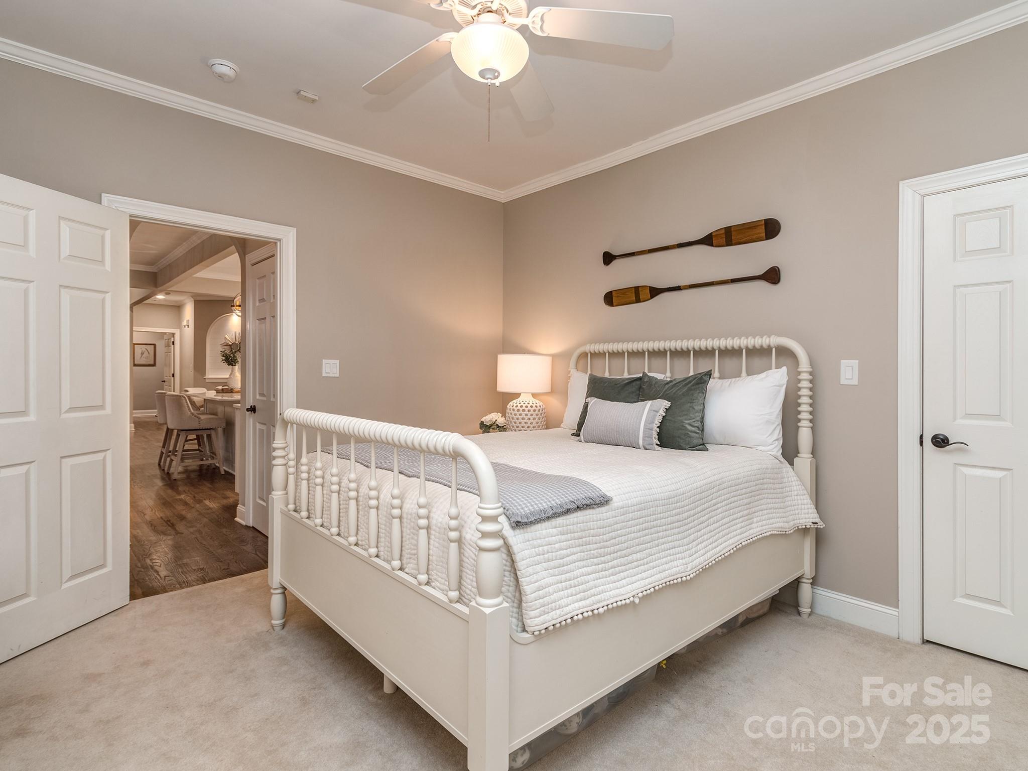 5951 Johnson Road Clover, SC 29710 - Photo 33 of 48 a bedroom with a bed and a chandelier
