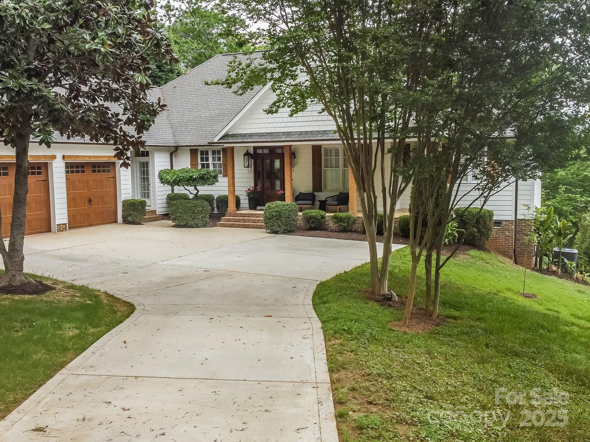 5951 Johnson Road Clover, SC 29710 - Photo 45 of 48 a front view of a house with a yard table and chairs