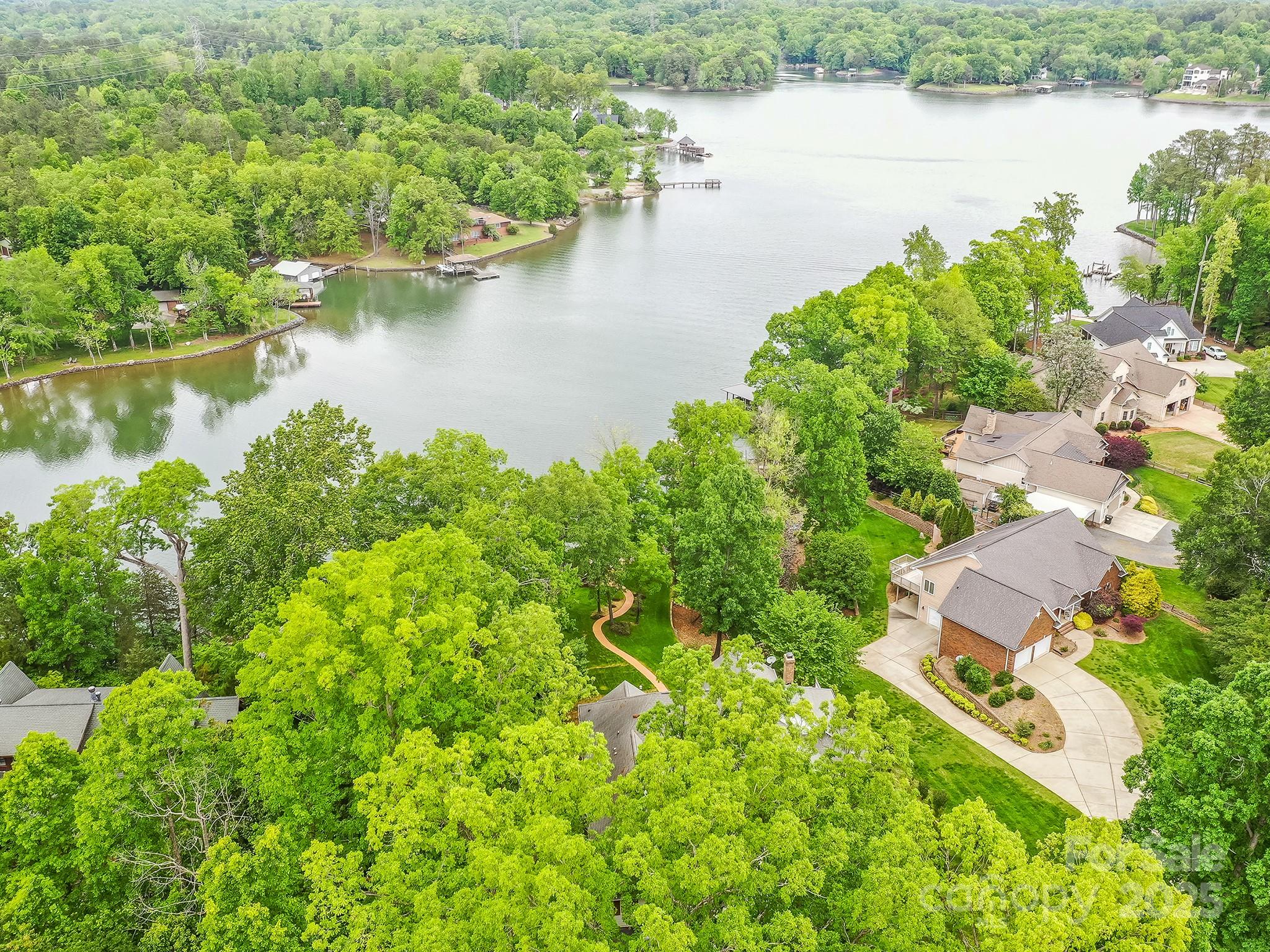 5951 Johnson Road Clover, SC 29710 - Photo 8 of 48 an aerial view of lake residential house with outdoor space and trees around