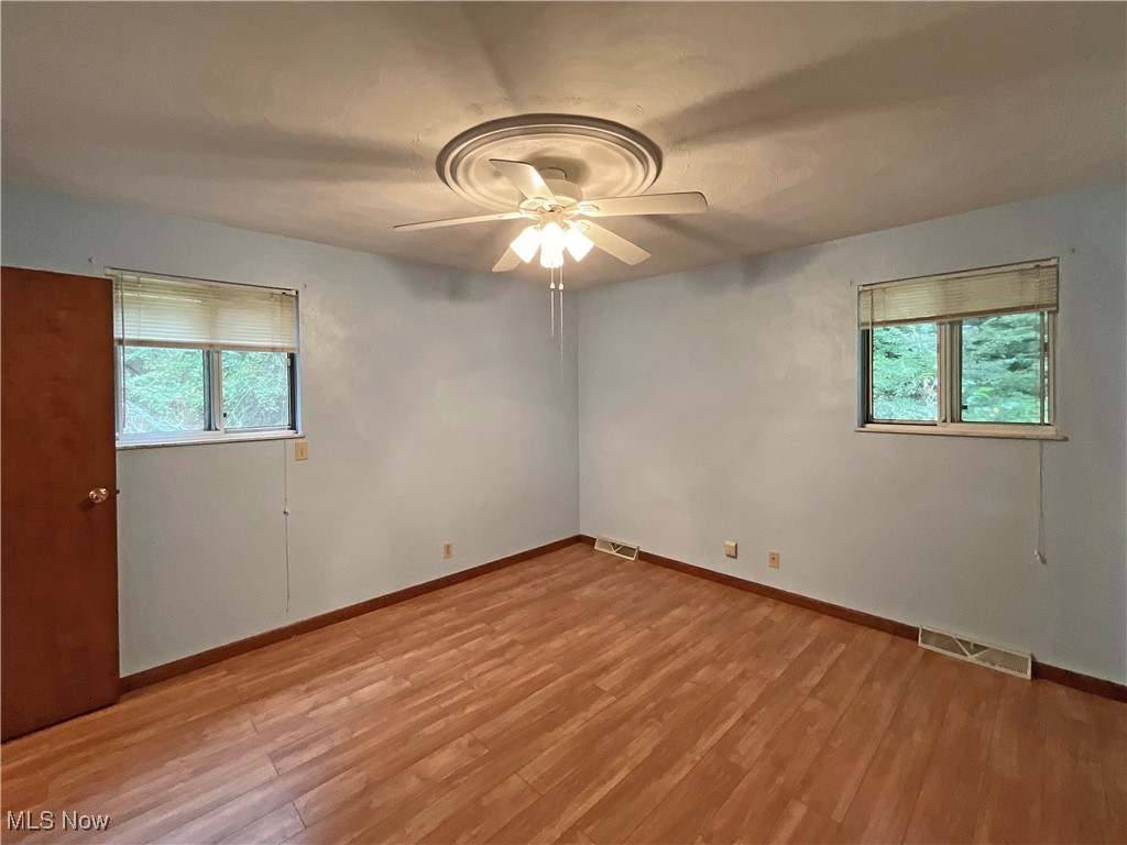 6568 Wylie Ridge Road New Cumberland, WV 26047 - Photo 9 of 28 Unfurnished room featuring light hardwood / wood-style floors and ceiling fan