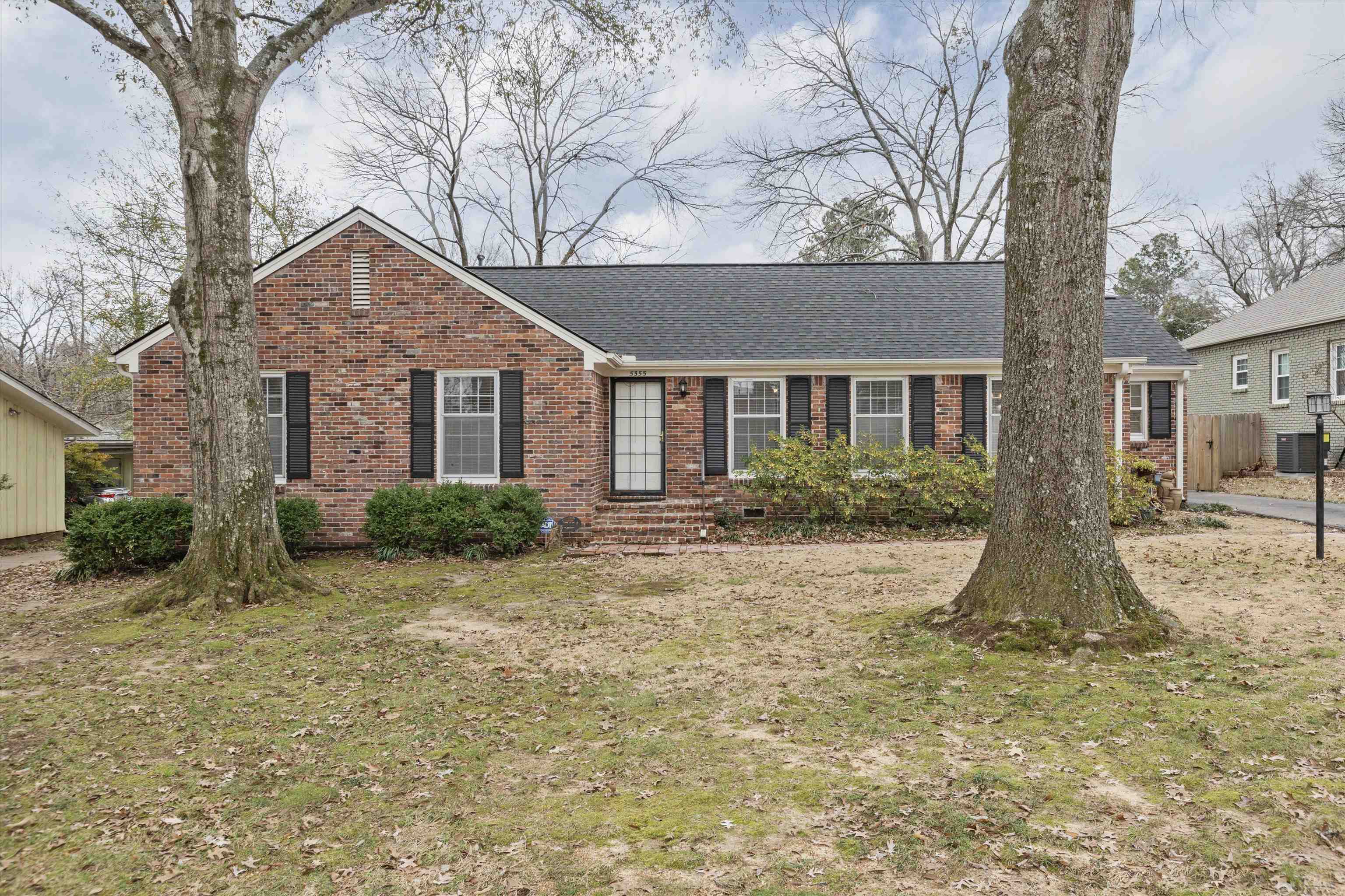 5555 Barfield Road Memphis, TN 38120 - Photo 1 of 23 front view of a house with a yard