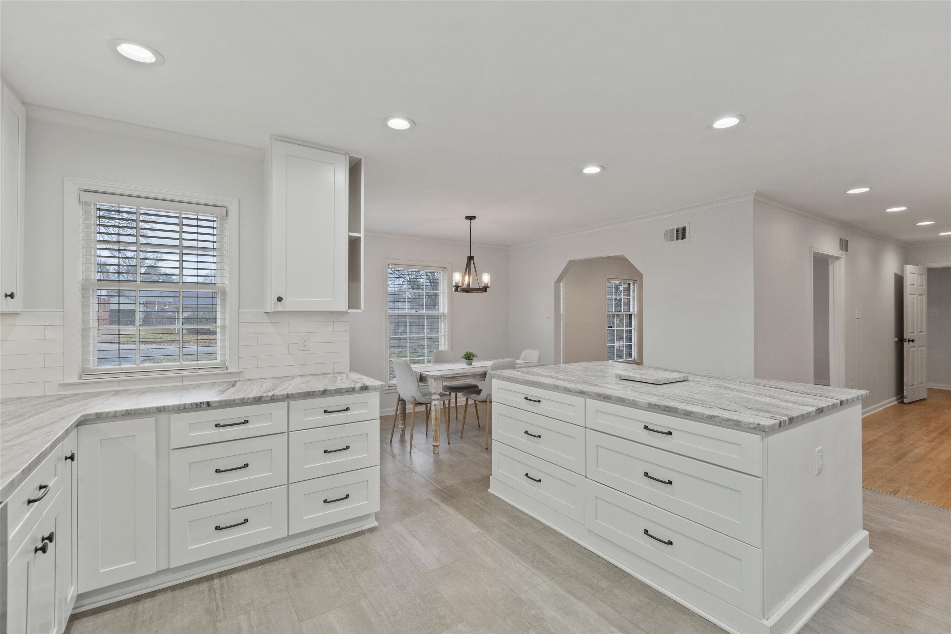 5555 Barfield Road Memphis, TN 38120 - Photo 5 of 23 a bathroom with a granite countertop sink mirror and