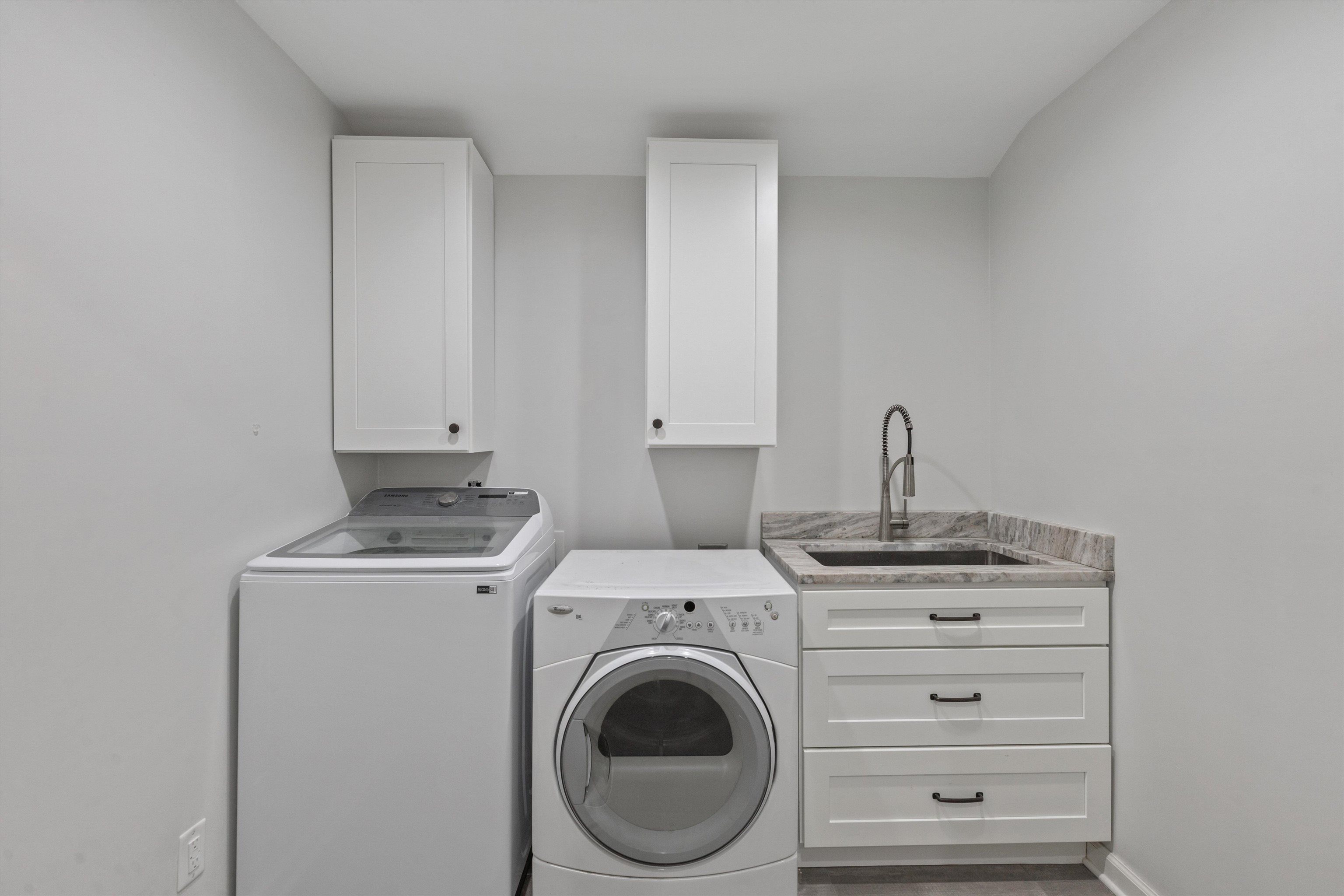 5555 Barfield Road Memphis, TN 38120 - Photo 9 of 23 a view of a storage & utility room with washer and dryer