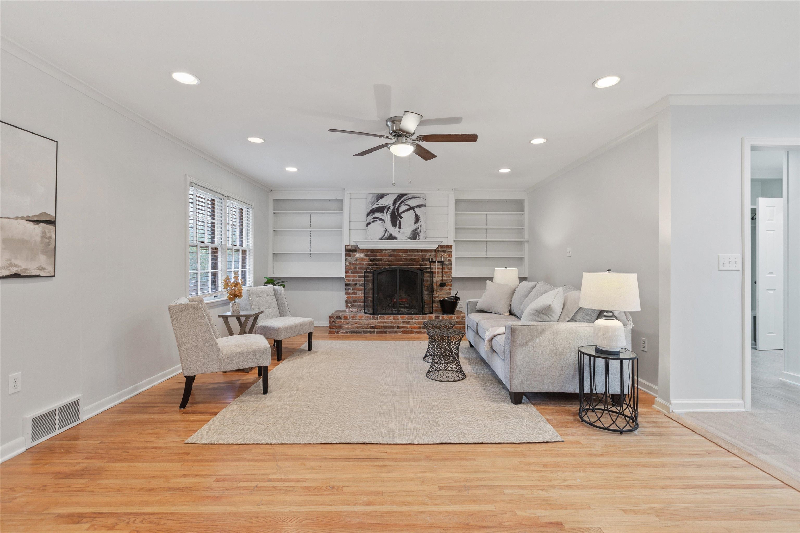 5555 Barfield Road Memphis, TN 38120 - Photo 10 of 23 a living room with furniture and a fireplace