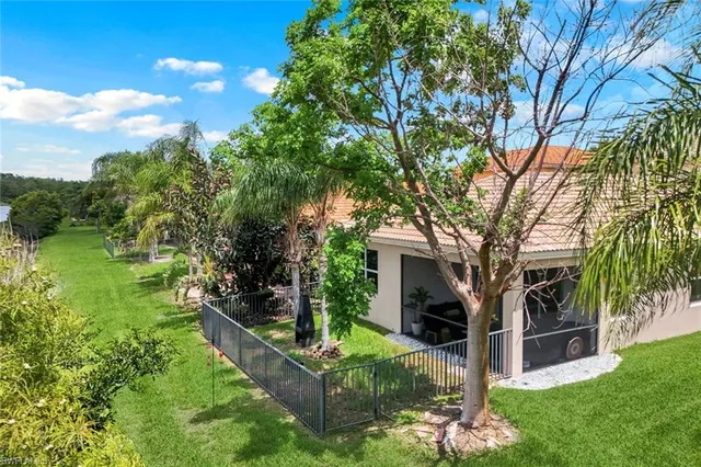 a view of house with backyard