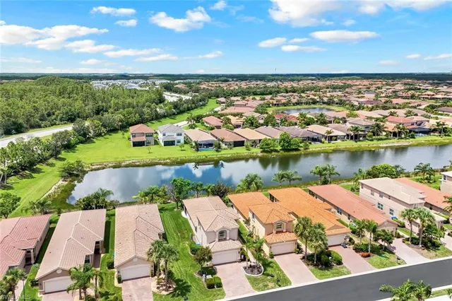 an aerial view of a house with a lake view