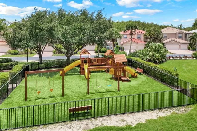 an aerial view of a house with a garden and trees