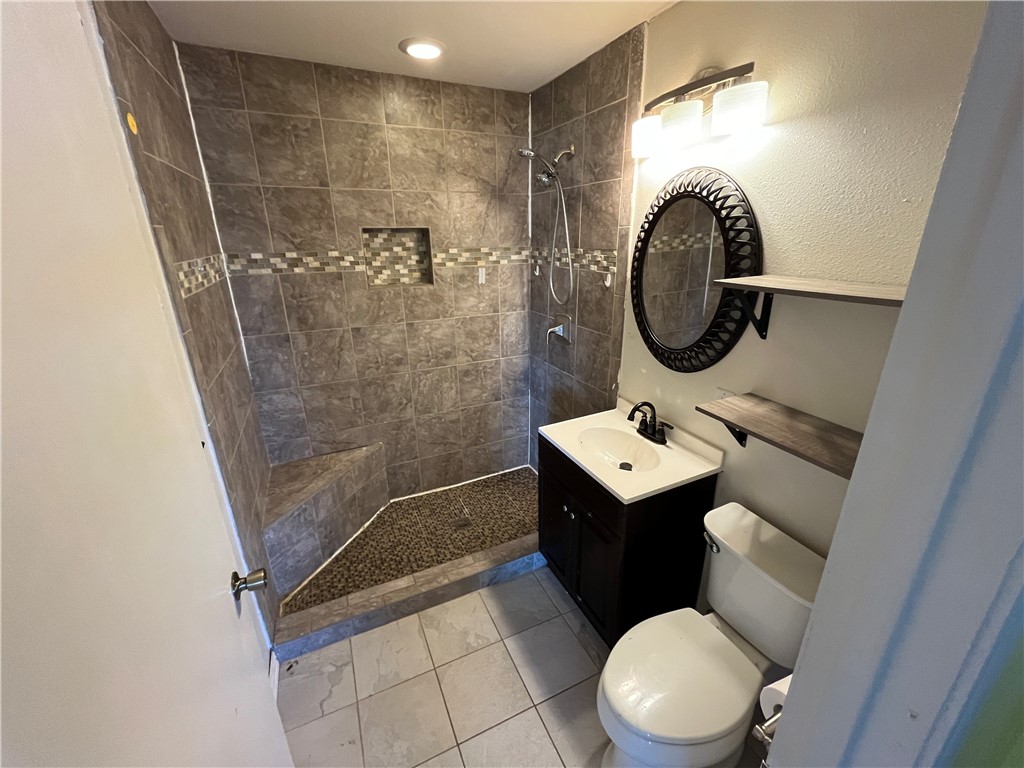 123 Burnet Street Port Lavaca, TX 77979 - Photo 4 of 9 a bathroom with a sink a toilet and a shower