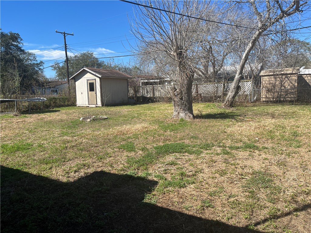 123 Burnet Street Port Lavaca, TX 77979 - Photo 8 of 9 a view of a yard in front of a house with a large tree