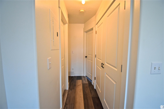 2480 West 450 South, Unit 2 Springville, UT 84663 - Photo 9 of 19 Hall featuring dark wood finished floors and electric panel