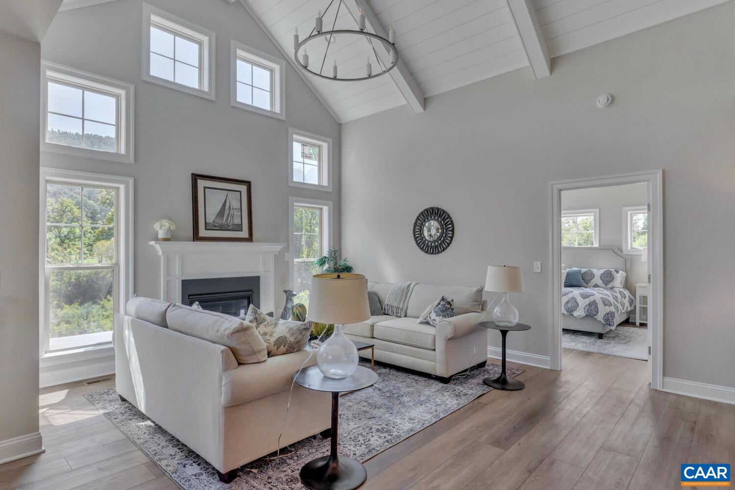 2 B Agatha Ridge Lane, Unit LOT 2 Crozet, VA 22932 - Photo 17 of 37 a living room with furniture and a table