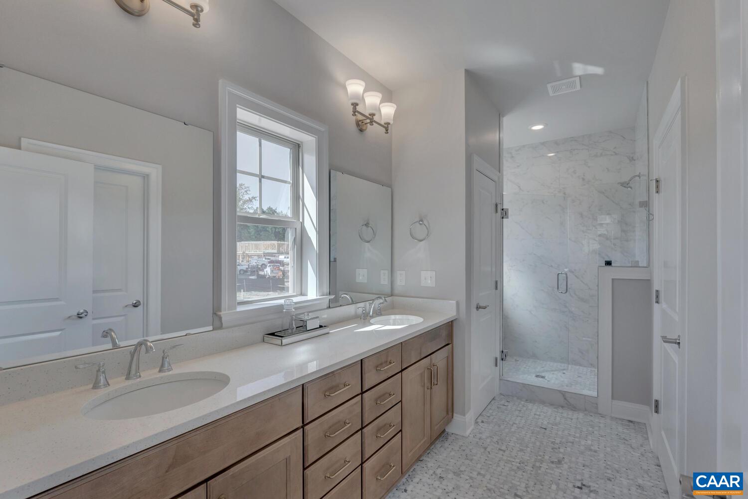2 B Agatha Ridge Lane, Unit LOT 2 Crozet, VA 22932 - Photo 21 of 37 a bathroom with double sink and a mirror