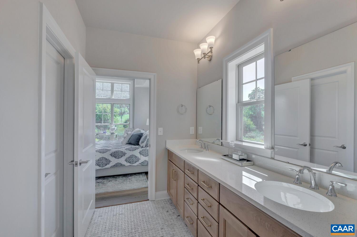2 B Agatha Ridge Lane, Unit LOT 2 Crozet, VA 22932 - Photo 22 of 37 a en suite bathroom with a sink double vanity and a mirror