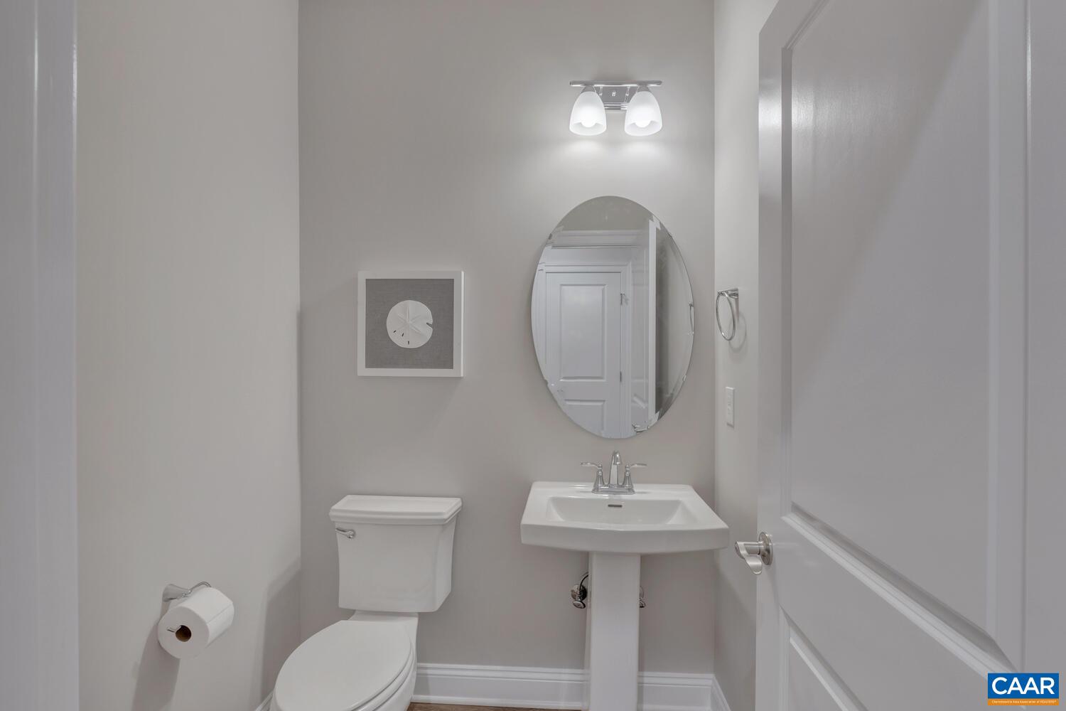 2 B Agatha Ridge Lane, Unit LOT 2 Crozet, VA 22932 - Photo 24 of 37 a bathroom with a toilet a sink and mirror