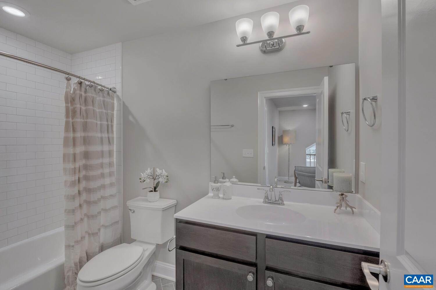 2 B Agatha Ridge Lane, Unit LOT 2 Crozet, VA 22932 - Photo 27 of 37 a bathroom with a sink a toilet and shower