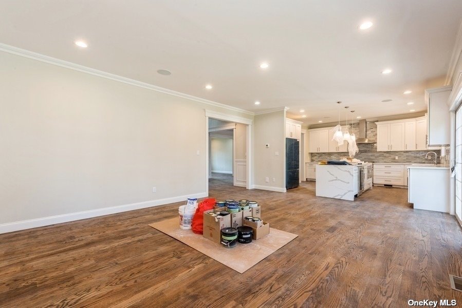 608 Meadowbrook Road North Merrick, NY 11566 - Photo 18 of 36 a room with stainless steel appliances wooden floor and view living room