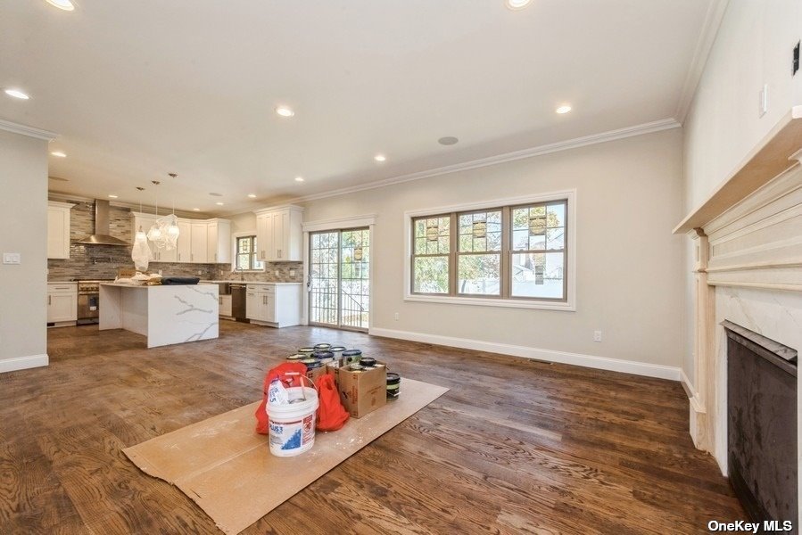 608 Meadowbrook Road North Merrick, NY 11566 - Photo 19 of 36 a living room with furniture and a fireplace