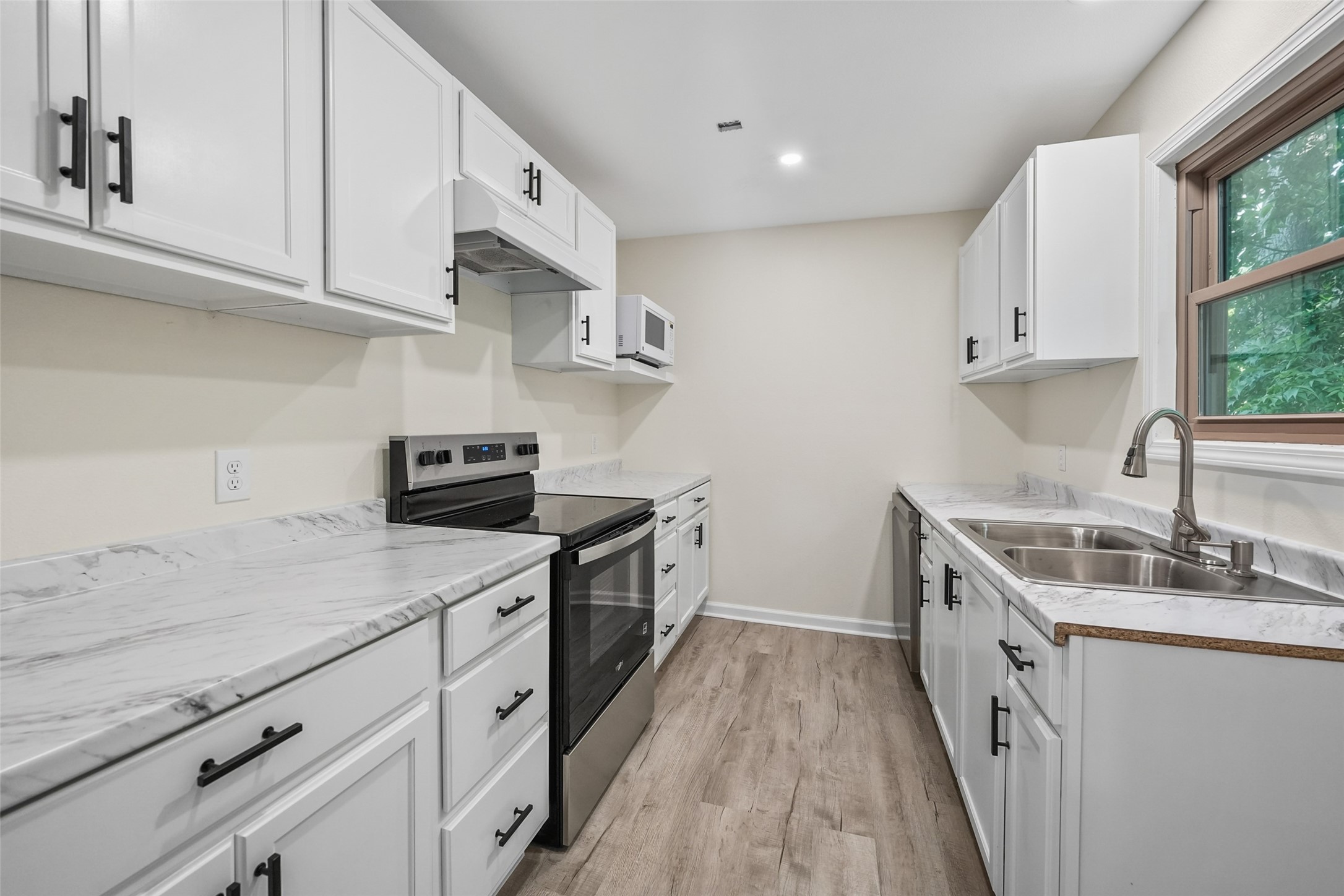 725 Lafayette Street Hempstead, TX 77445 - Photo 16 of 20 Galley kitchen featuring ample cabinet storage and workspace