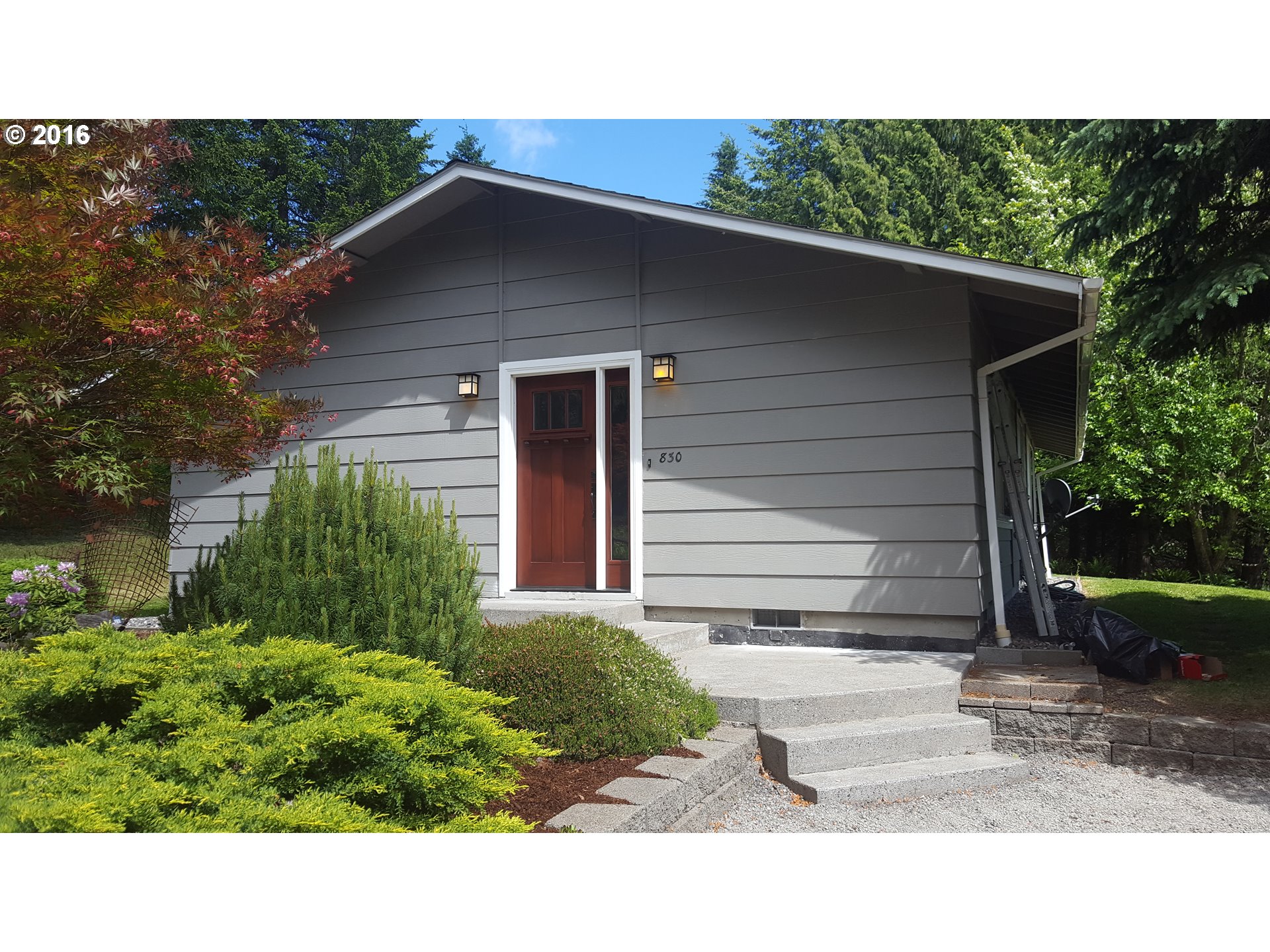 830 Northeast Bone Road Stevenson, WA 98648 - Photo 1 of 18 a black and white building with trees in the background