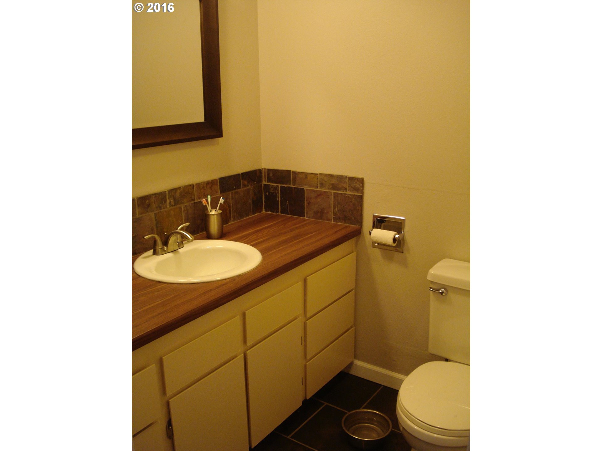 830 Northeast Bone Road Stevenson, WA 98648 - Photo 13 of 18 a bathroom with a granite countertop toilet sink and mirror